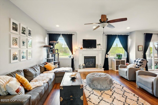2153 S Withers Rd, Wasilla, AK 99654 - living room with ceiling fan, wood finished floors, a large fireplace, and recessed lighting