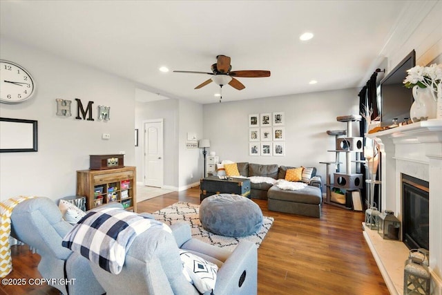 2153 S Withers Rd, Wasilla, AK 99654 - living area with a ceiling fan, wood finished floors, recessed lighting, and a glass covered fireplace