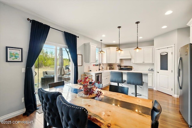 2153 S Withers Rd, Wasilla, AK 99654 - dining area with healthy amount of natural light, wood finished floors, and recessed lighting