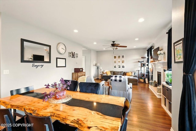 2153 S Withers Rd, Wasilla, AK 99654 - dining room with ceiling fan, wood finished floors, recessed lighting, and a fireplace