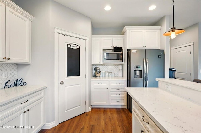 2153 S Withers Rd, Wasilla, AK 99654 - kitchen with appliances with stainless steel finishes, tasteful backsplash, white cabinets, decorative light fixtures, and recessed lighting