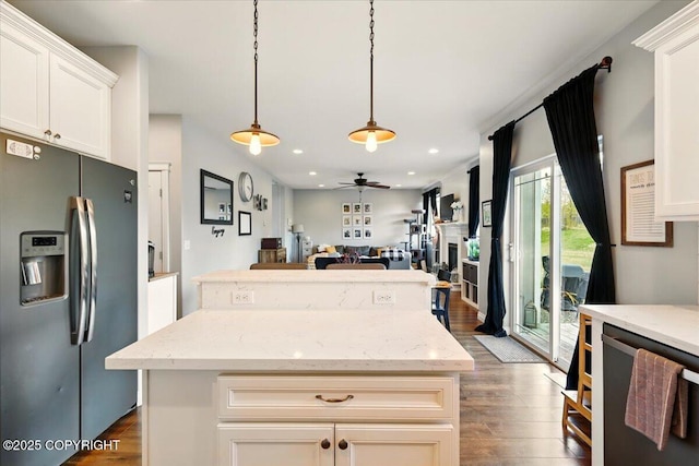 2153 S Withers Rd, Wasilla, AK 99654 - kitchen with stainless steel appliances, a center island, dark wood-type flooring, open floor plan, and ceiling fan