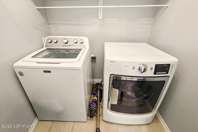 2153 S Withers Rd, Wasilla, AK 99654 - washroom featuring washer and dryer and light tile patterned floors