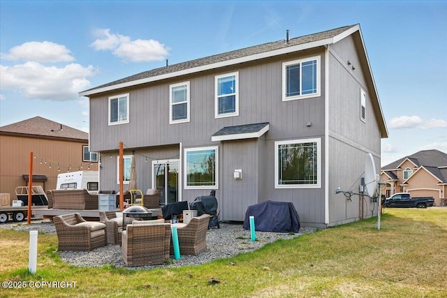 2153 S Withers Rd, Wasilla, AK 99654 - rear view of house with an outdoor living space with a fire pit, a lawn, and a shingled roof