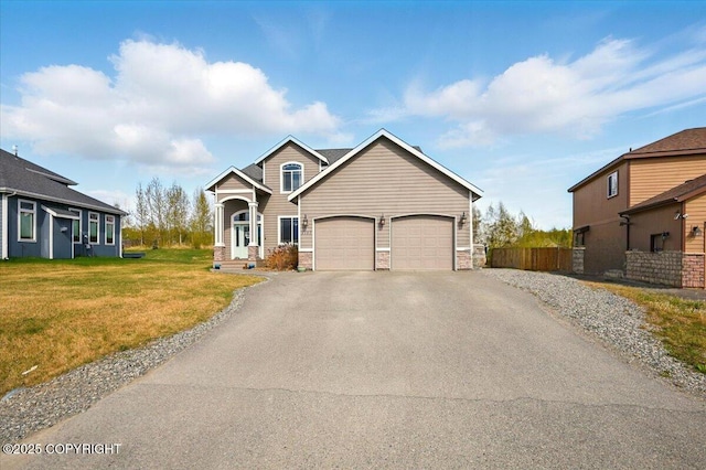 2153 S Withers Rd, Wasilla, AK 99654 - traditional home with asphalt driveway, an attached garage, and stone siding