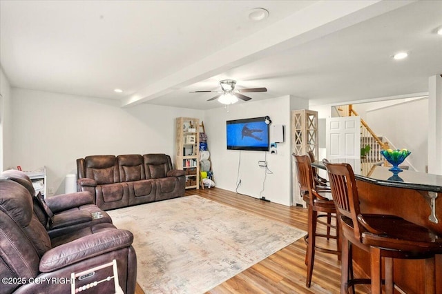 living room featuring wood finished floors, a ceiling fan, stairway, and recessed lighting