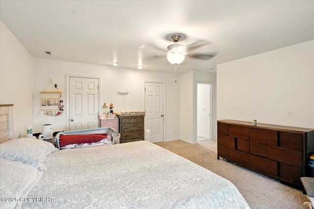 bedroom with light carpet, baseboards, and a ceiling fan
