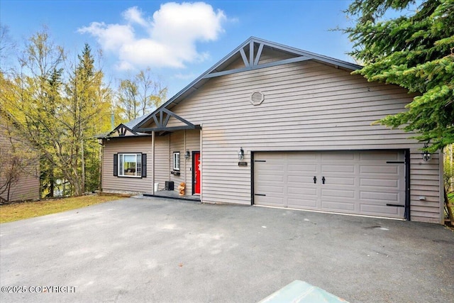view of front of house featuring asphalt driveway