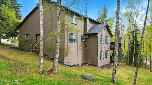 view of property exterior featuring a yard