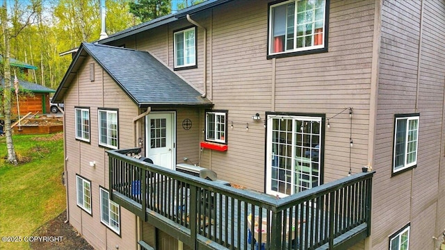 back of house featuring a deck
