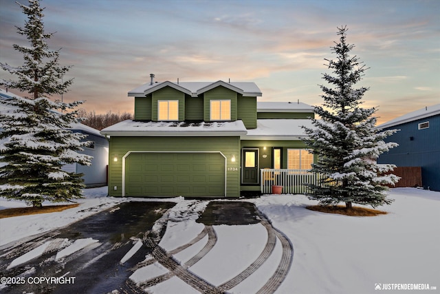 1734 Concord Hill Dr, Anchorage, AK 99515 - view of front of home featuring a porch, driveway, and a garage