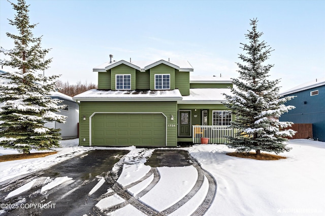 1734 Concord Hill Dr, Anchorage, AK 99515 - view of front of property with a garage, a porch, and aphalt driveway