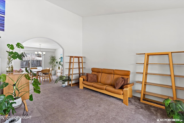 1734 Concord Hill Dr, Anchorage, AK 99515 - sitting room with a chandelier, carpet flooring, and arched walkways