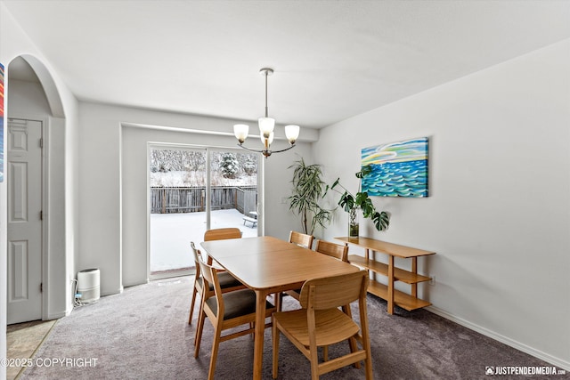 1734 Concord Hill Dr, Anchorage, AK 99515 - carpeted dining room featuring an inviting chandelier and arched walkways