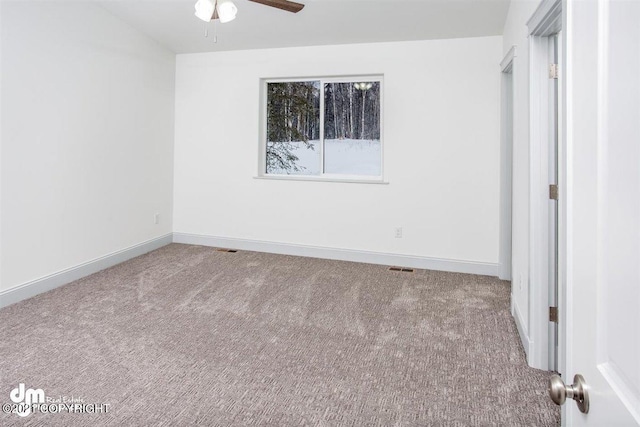 unfurnished bedroom with carpet floors, baseboards, and ceiling fan