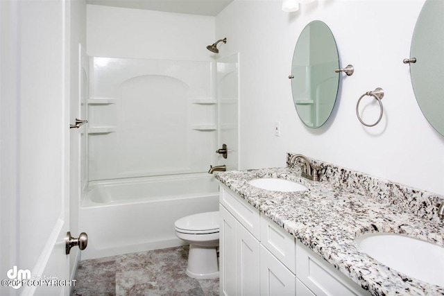 bathroom with toilet, washtub / shower combination, and double vanity