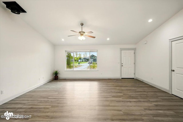 unfurnished living room with wood finished floors, ceiling fan, recessed lighting, and baseboards