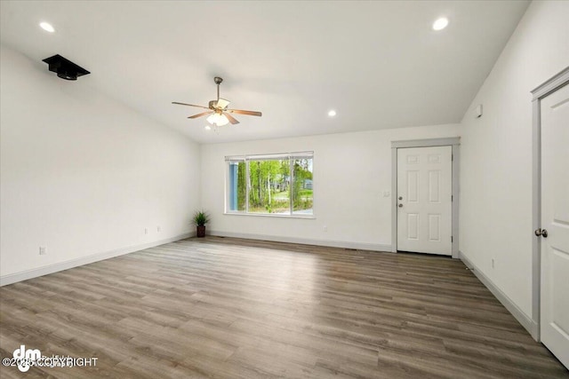 spare room with ceiling fan, wood finished floors, recessed lighting, and baseboards