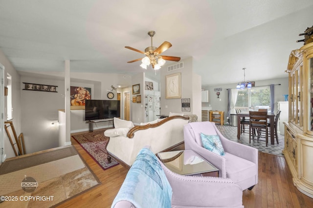living room with ceiling fan and hardwood / wood-style floors