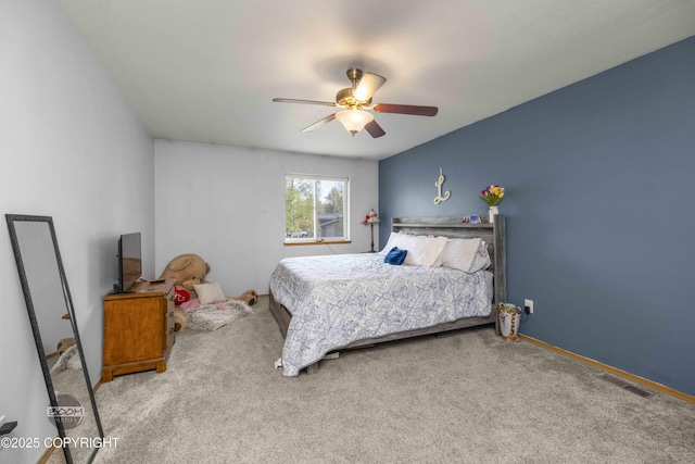 carpeted bedroom featuring a ceiling fan and baseboards