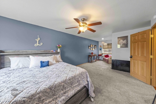 carpeted bedroom featuring ceiling fan