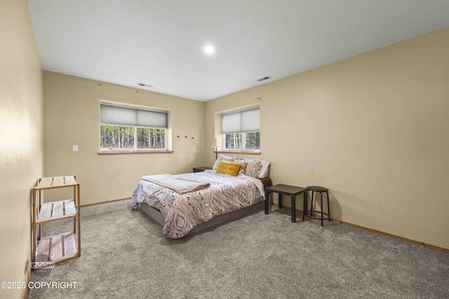 carpeted bedroom featuring baseboards