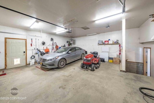 garage featuring a garage door opener