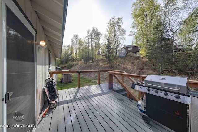 wooden deck featuring grilling area