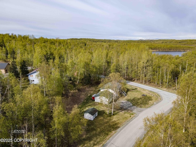 aerial view of a heavily wooded area and a large body of water