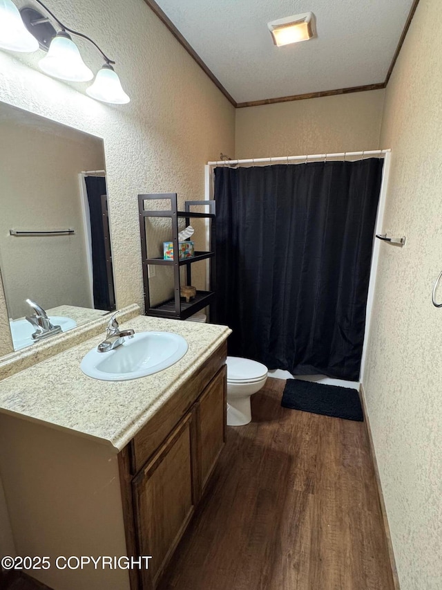 46050 Lax Cir, Soldotna, AK 99669 - full bath with a textured wall, vanity, curtained shower, wood finished floors, and ornamental molding