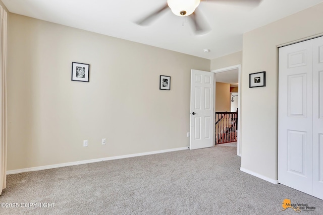 3690 S Granite Ln, Wasilla, AK 99654 - unfurnished bedroom with carpet floors, baseboards, ceiling fan, and a closet