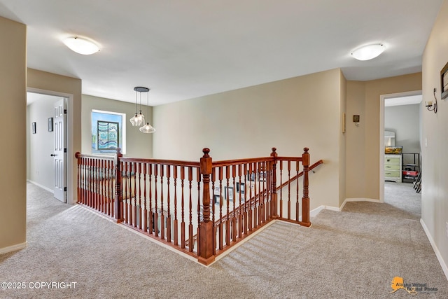 3690 S Granite Ln, Wasilla, AK 99654 - hallway featuring an upstairs landing, carpet, and baseboards