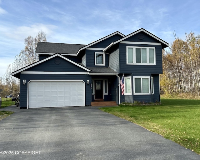 3690 S Granite Ln, Wasilla, AK 99654 - view of front of house with driveway, a front lawn, and an attached garage