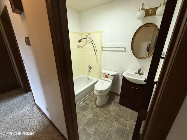 bathroom with vanity, shower / bath combination, and toilet