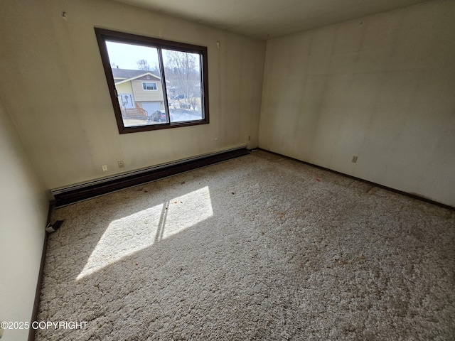 spare room with a baseboard heating unit