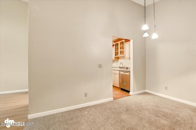2631 Palmer Ct # C6, Anchorage, AK 99508 - empty room with a sink, baseboards, and light carpet