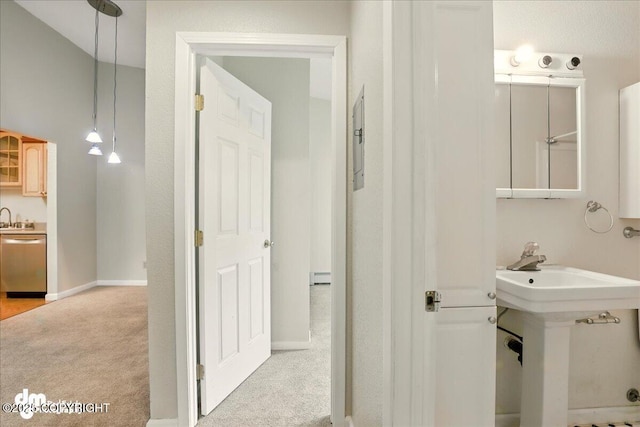 2631 Palmer Ct # C6, Anchorage, AK 99508 - bathroom featuring baseboard heating, a sink, and baseboards