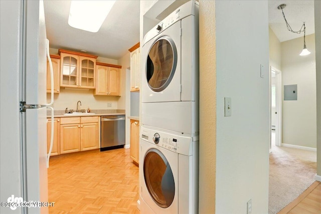 2631 Palmer Ct # C6, Anchorage, AK 99508 - laundry room featuring stacked washing machine and dryer and electric panel