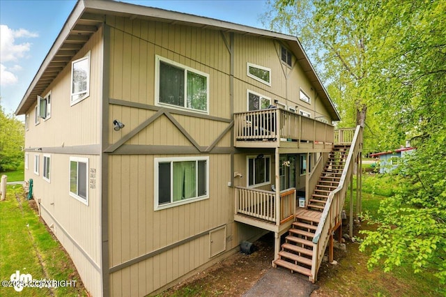 2631 Palmer Ct # C6, Anchorage, AK 99508 - back of house with stairs and a wooden deck