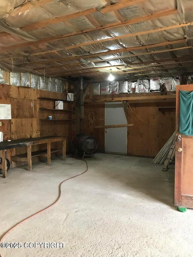 unfinished below grade area with wood walls