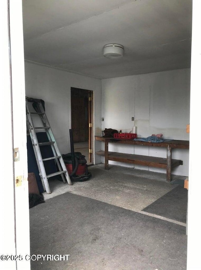 garage with a workshop area