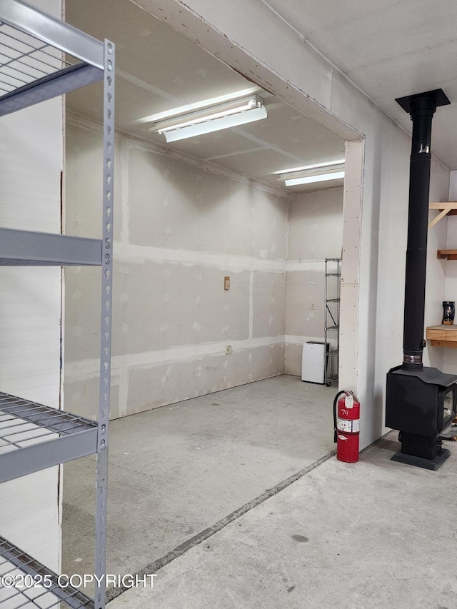 5920 Old Valdez Trl, Salcha, AK 99714 - garage featuring a wood stove