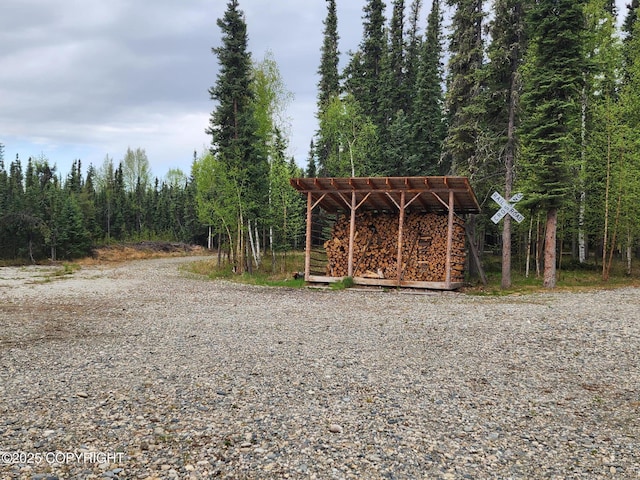 5920 Old Valdez Trl, Salcha, AK 99714 - view of outbuilding featuring a wooded view