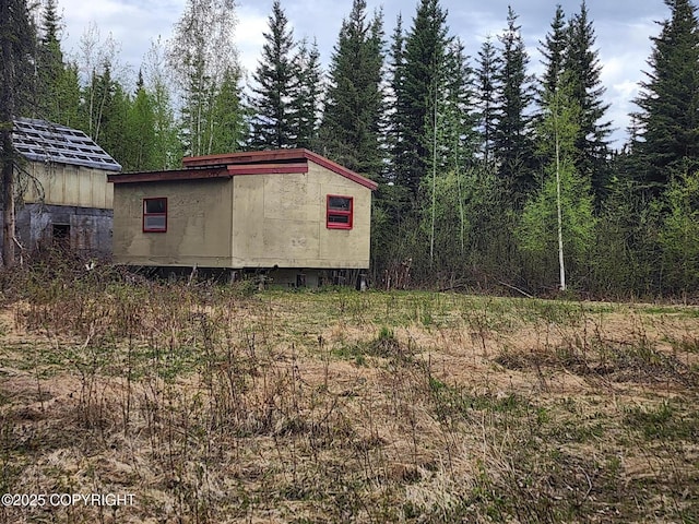 5920 Old Valdez Trl, Salcha, AK 99714 - view of outdoor structure with a wooded view