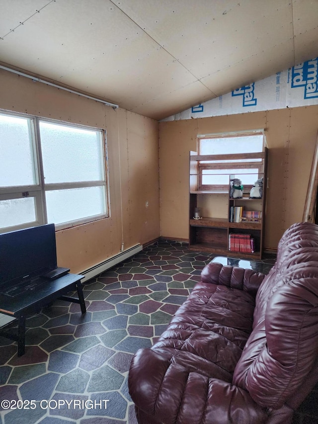 5920 Old Valdez Trl, Salcha, AK 99714 - living room with a baseboard radiator, lofted ceiling, and stone floors
