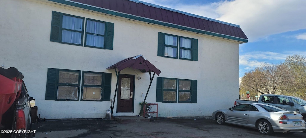 3835 Carleton Ave, Anchorage, AK 99517 - view of property featuring stucco siding