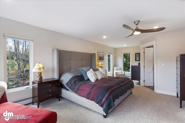 carpeted bedroom with baseboards, a ceiling fan, a baseboard heating unit, and recessed lighting