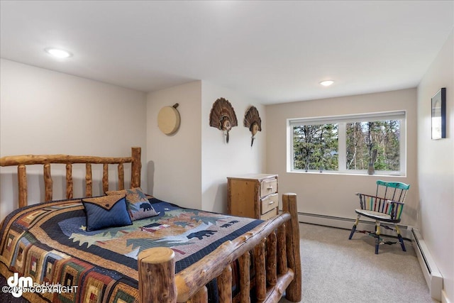 bedroom with light carpet, a baseboard heating unit, and recessed lighting