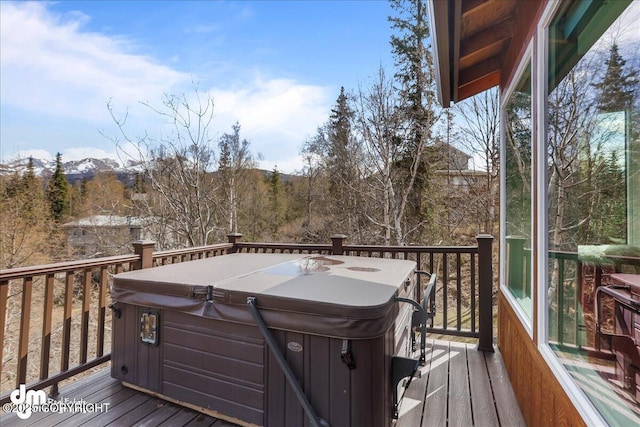 deck featuring a hot tub