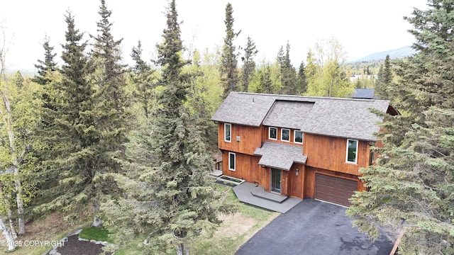 6816 Round Tree Dr, Anchorage, AK 99507 - view of front of house featuring roof with shingles, asphalt driveway, and a garage